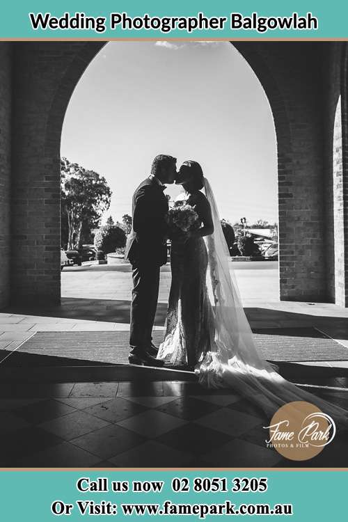 Photo of the Groom and the Bride kissing at the front of the church Balgowlah NSW 2093