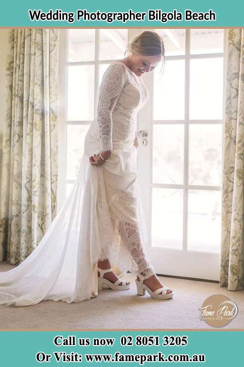 Photo of the Groom checking her shoes Bilgola Beach NSW 2107