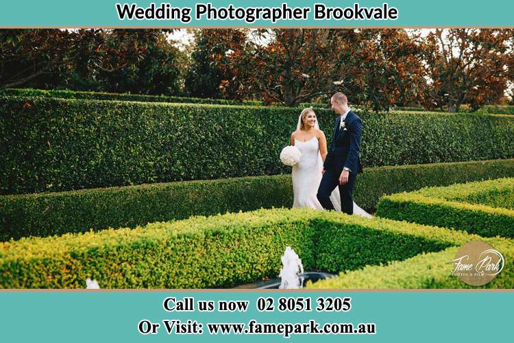 Photo of the Bride and the Groom walking on the garden Brookvale NSW 2100