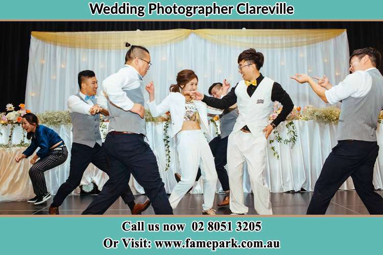 Photo of the Bride and the Groom dancing with the groomsmen on the dance floor Clareville NSW 2107