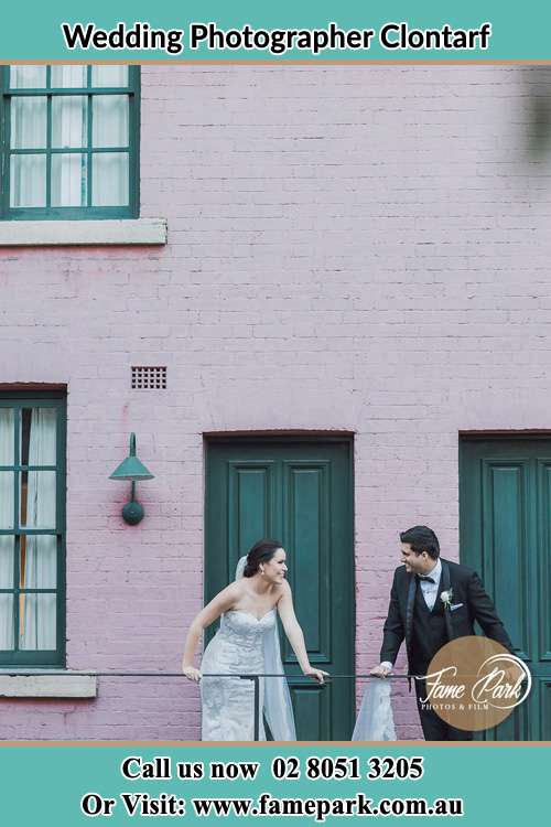 Photo of the Bride and the Groom looking at each other at the balcony Clontarf NSW 2093