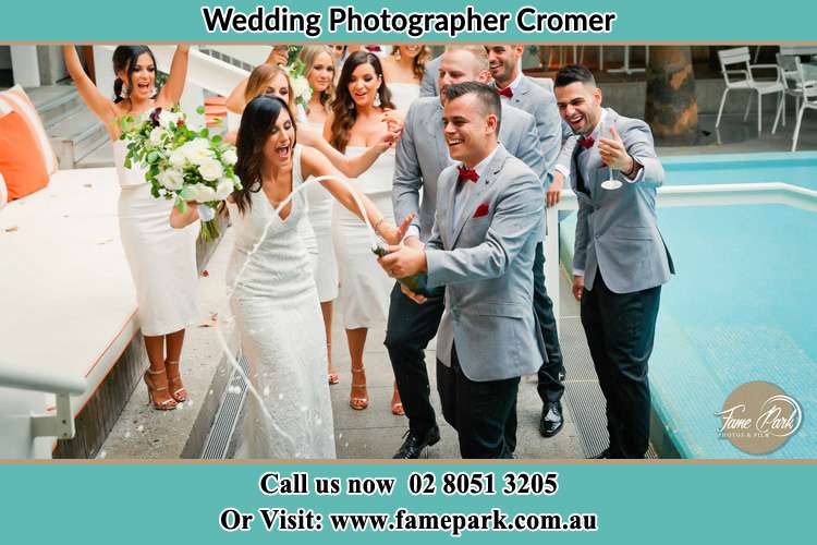 Photo of the Bride and the Groom celebrating with the secondary sponsor Cromer NSW 2099