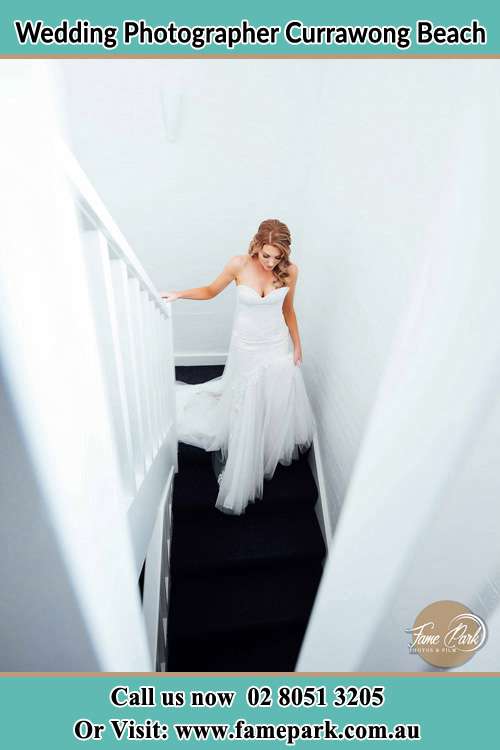 Photo of the Bride going down the stair Currawong Beach NSW 2108