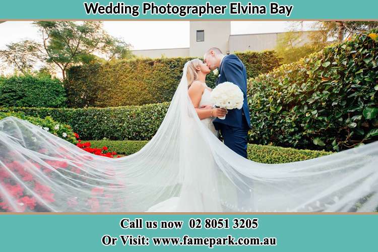 Photo of the Bride and the Groom kissing at the garden Elvina Bay NSW 2105