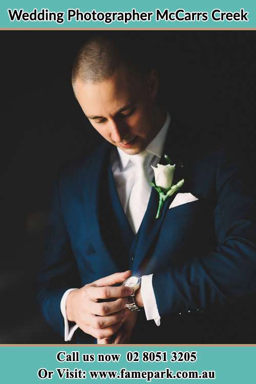 Photo of the Groom checking the time McCarrs Creek NSW 2105