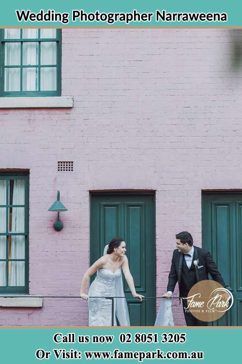 Photo of the Bride and the Groom looking each other at the balcony Narraweena NSW 2099