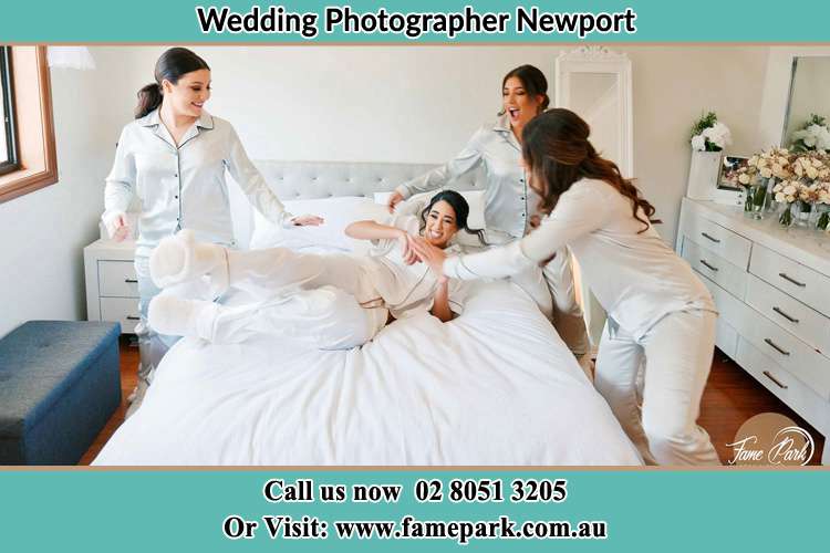 Photo of the Bride and the bridesmaids plating on bed Newport NSW 2106