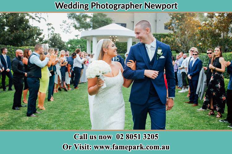 Photo of the Groom and the Bride looking each other while walking Newport NSW 2106