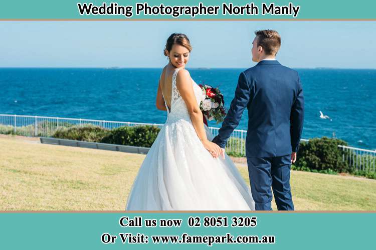 Photo of the Bride and the Groom holding hands at the yard North Manly Beach NSW 2100