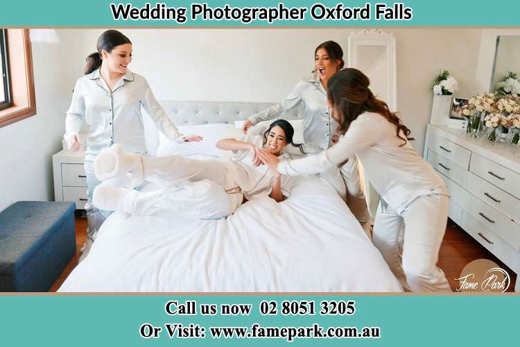 Photo of the Bride and the bridesmaids playing on bed Oxford Falls NSW 2100