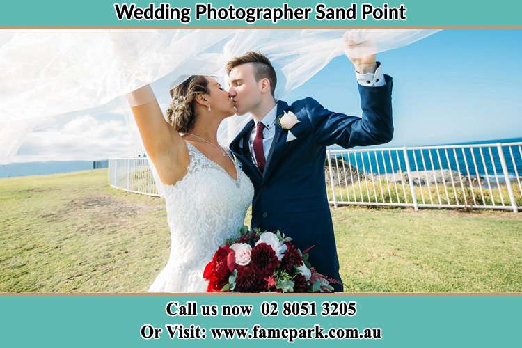 Photo of the Bride and the Groom kissing at the yard Sandy Point NSW 2172