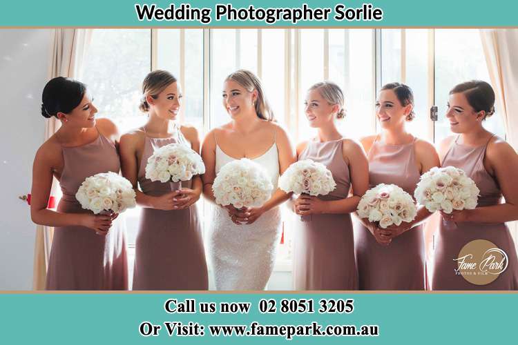 Photo of the Bride and the bridesmaids holding flower bouquet Sorlie NSW 2086