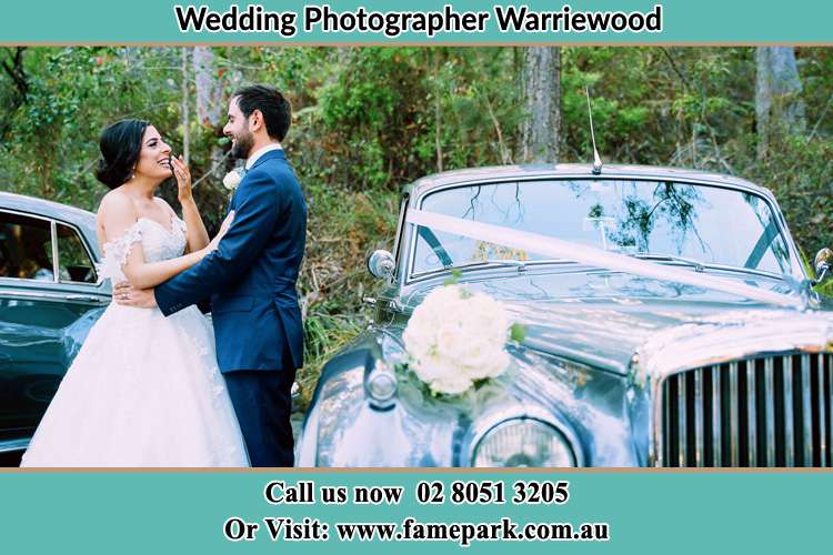 Photo of the Bride and the Groom near the bridal car Warriewood NSW 2102